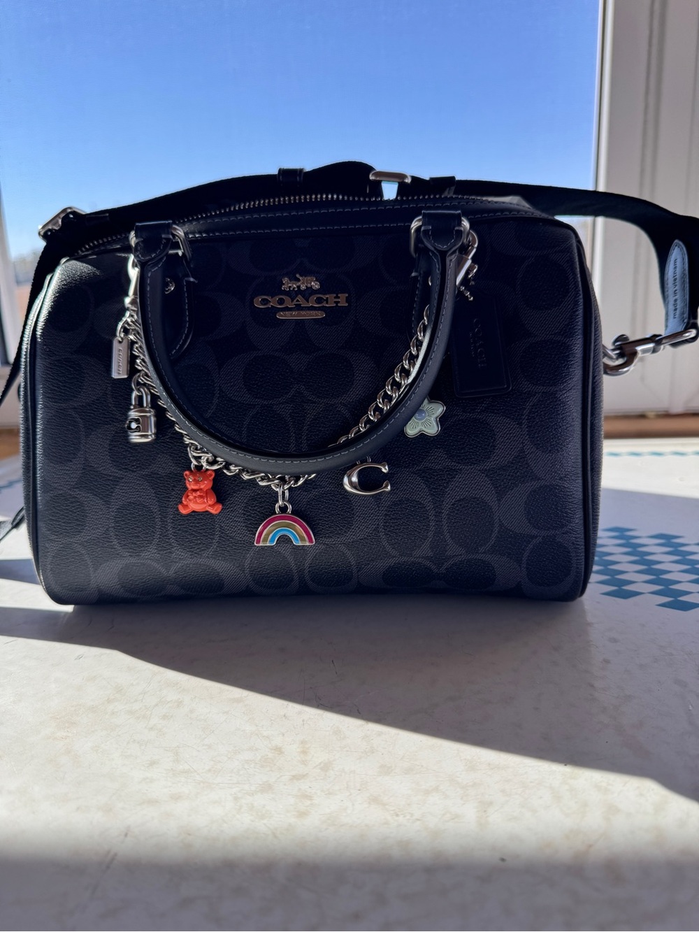 Coach Black Signature Rowan Satchel with Coach Charm Chain and Guitar Strap.